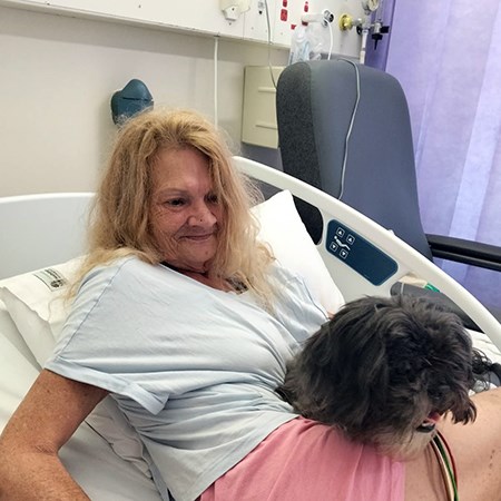 Denise with her dog in hosptial
