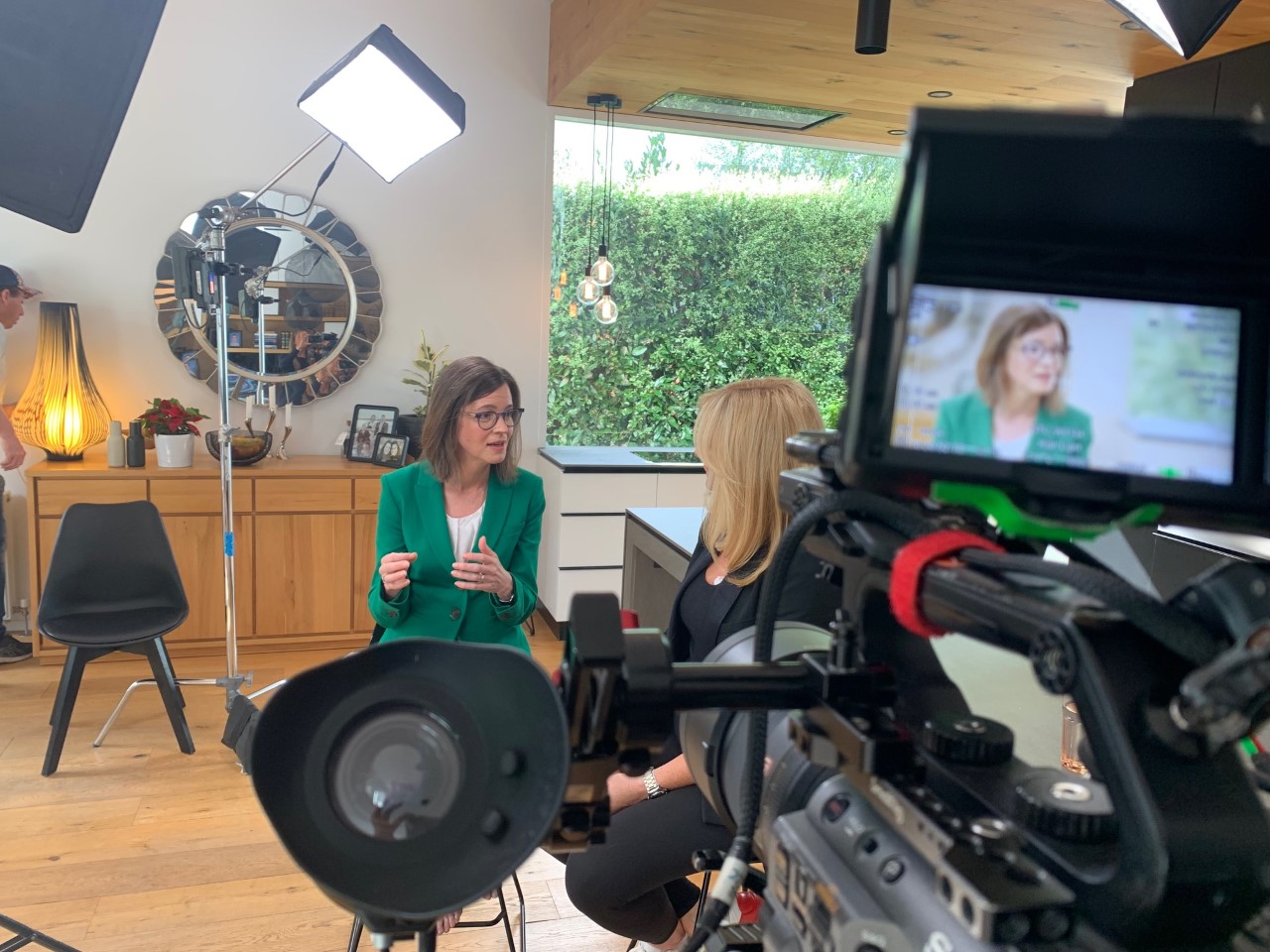 Woman talking to reporters