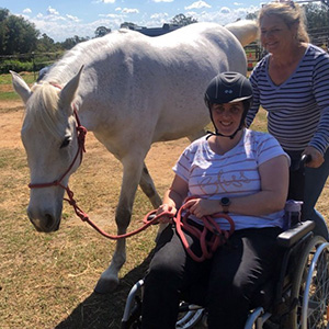 Sheree in her wheelchair with her horse