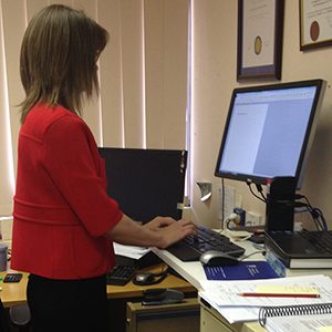 Dr Coralie English at her standing desk