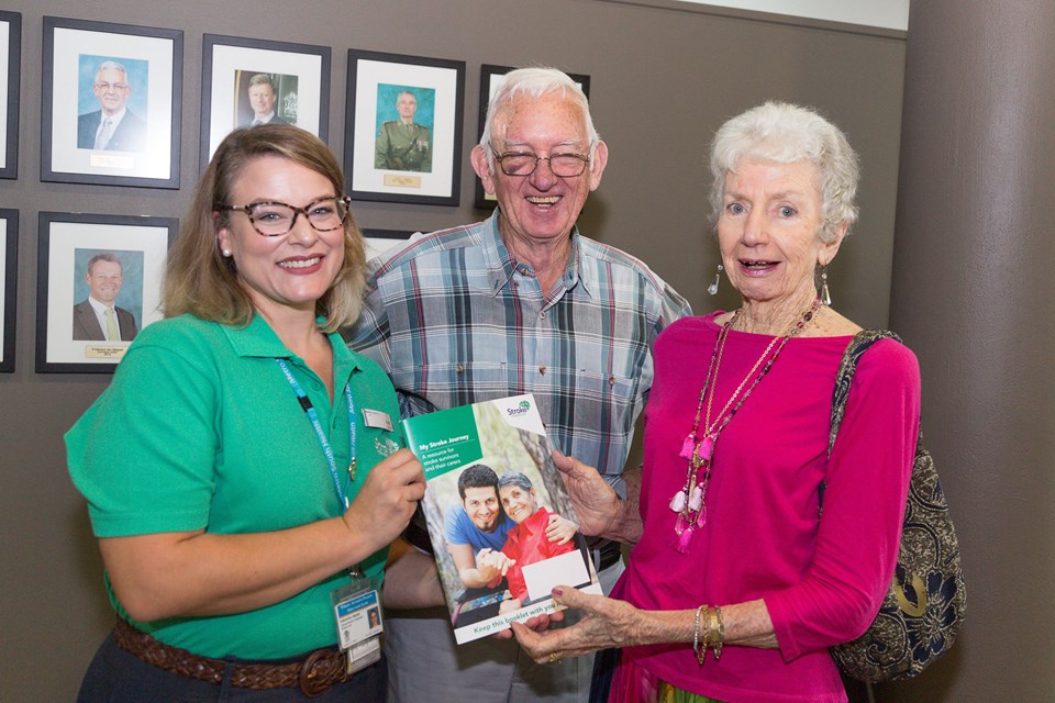 Three people with stroke journey booklet