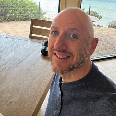 Paul Bovington smiling on the veranda