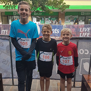 Trey and his two brothers at the start line of a run 