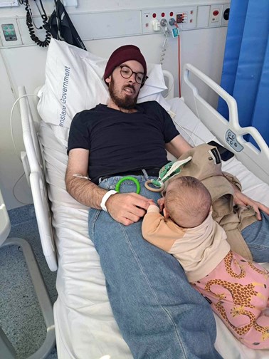 Philip with his daughter in hospital