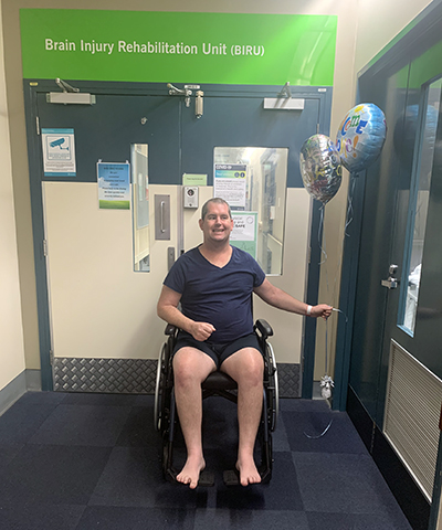 Shaun in hospital in his wheelchair