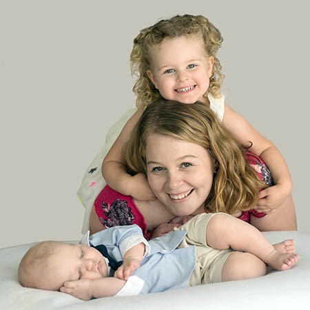 Caleb with his mum and sister
