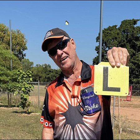 Richard holding up a learner tile
