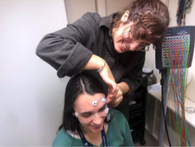 Margaret putting elctrodes on