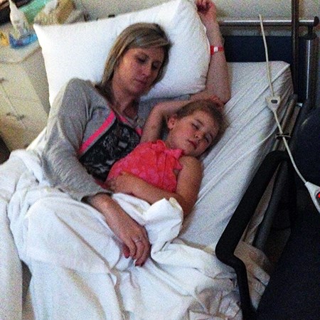 Chloe with her daughter sleeping in hospital