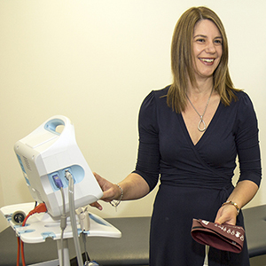 Dr Coralie English with a BP machine